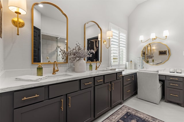 bathroom with vanity and vaulted ceiling