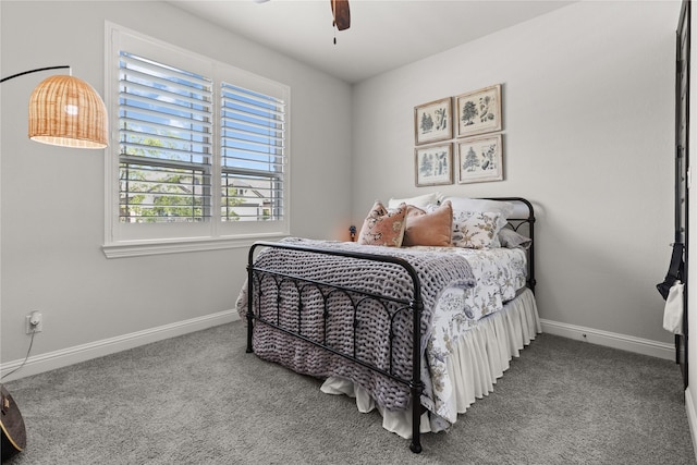 bedroom featuring ceiling fan and carpet