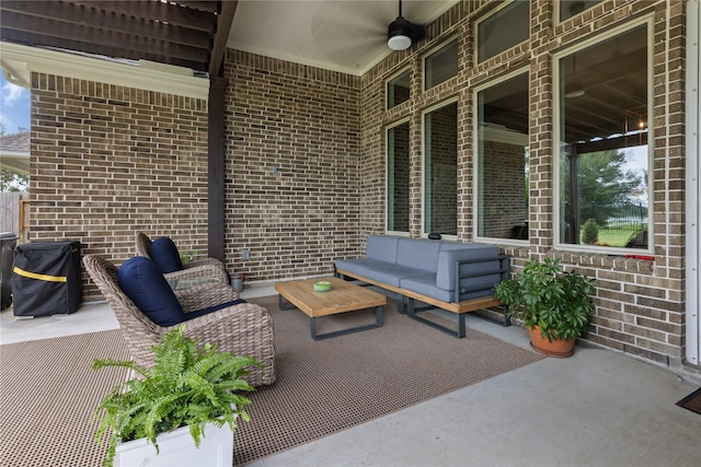 view of patio with outdoor lounge area and ceiling fan