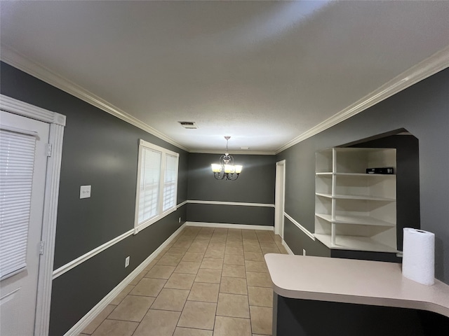 interior space with an inviting chandelier, light tile patterned floors, and ornamental molding