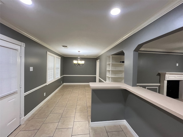 corridor featuring light tile patterned floors, crown molding, and a chandelier