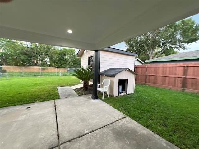 view of patio / terrace featuring a storage shed