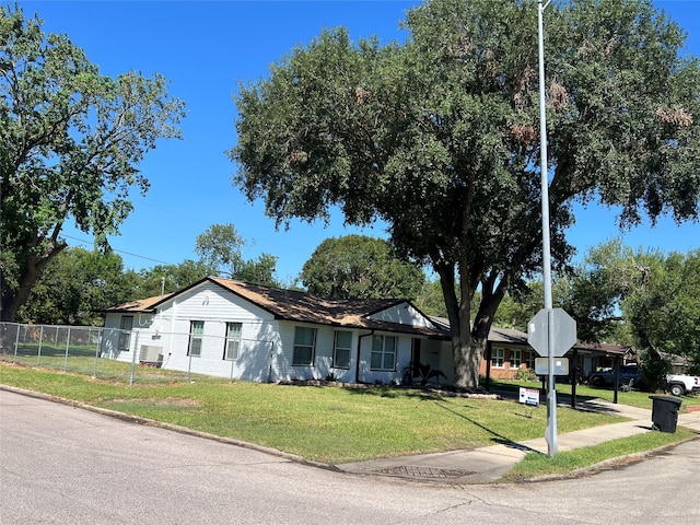 ranch-style home featuring a front yard