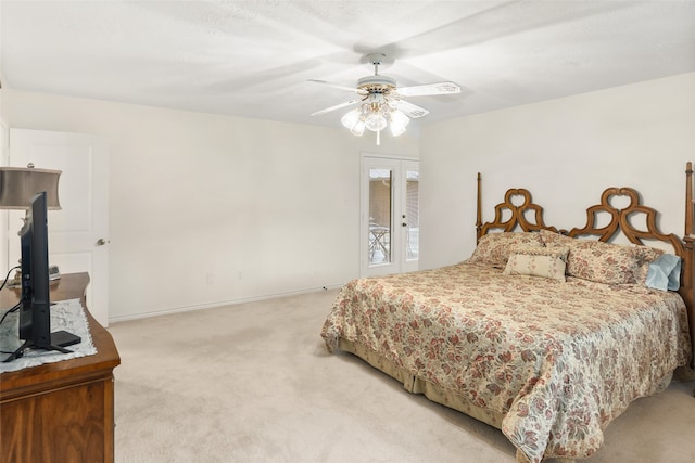 bedroom with ceiling fan, light colored carpet, and access to outside