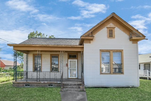 bungalow featuring a front yard and a porch