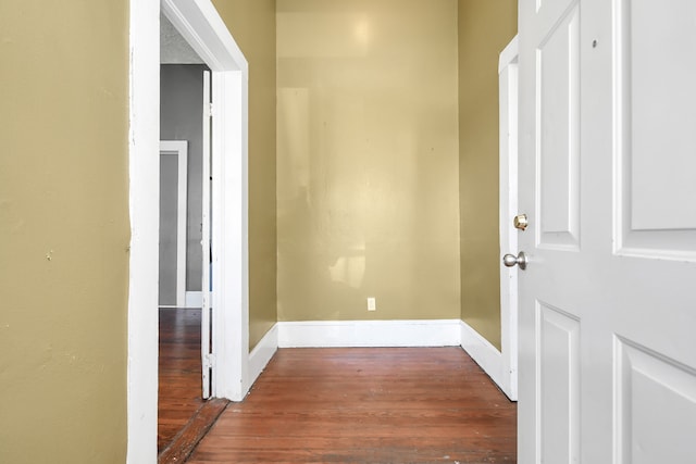 hall with dark wood-type flooring