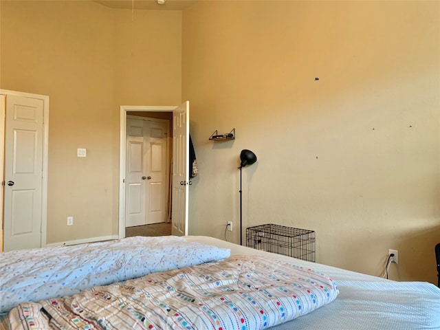 bedroom featuring a high ceiling