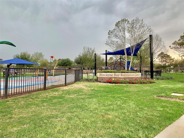 exterior space with a playground and a yard