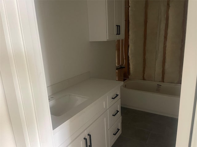 bathroom with tile patterned floors and vanity