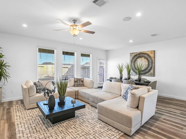 living room with hardwood / wood-style floors and ceiling fan