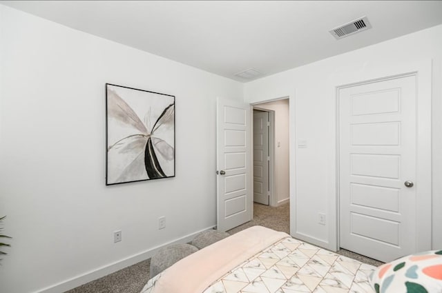 bedroom featuring light carpet