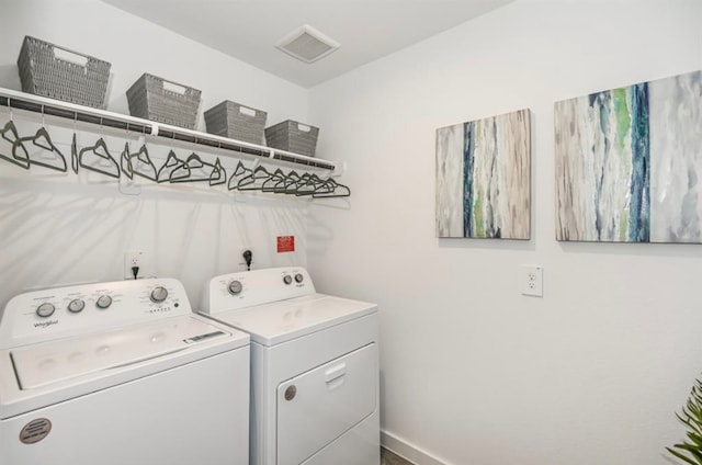 laundry room with washing machine and clothes dryer