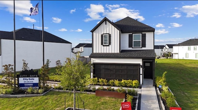 view of front of house featuring a garage and a front yard