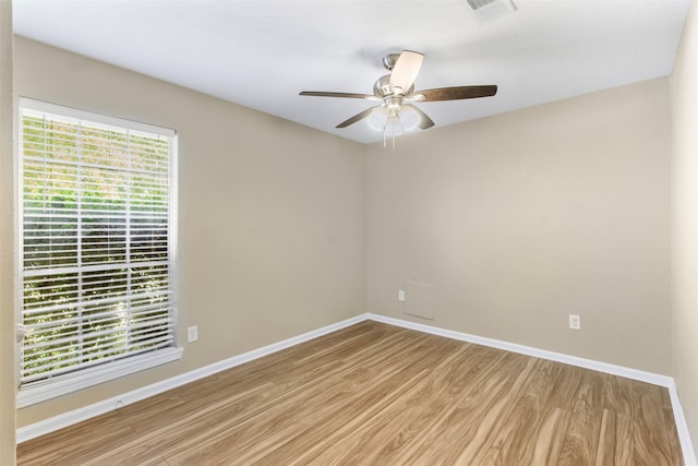 unfurnished room featuring light wood-type flooring and ceiling fan