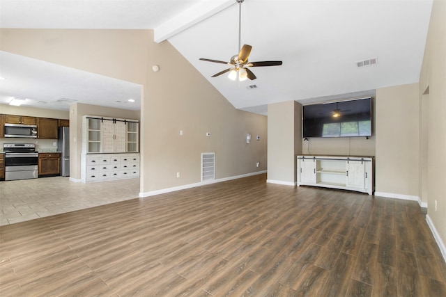 unfurnished living room featuring beamed ceiling, dark hardwood / wood-style floors, ceiling fan, and high vaulted ceiling