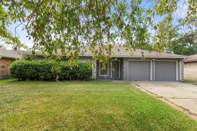 single story home featuring a garage and a front lawn