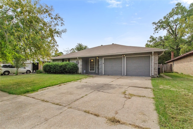 ranch-style home with a front lawn and a garage