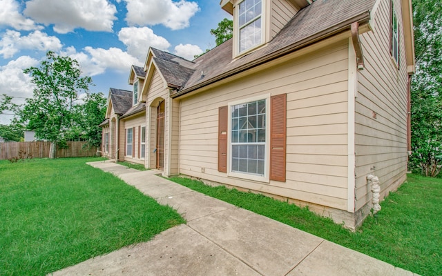 view of home's exterior featuring a yard