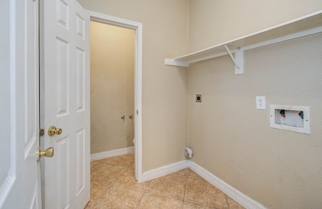 clothes washing area featuring hookup for a washing machine, light tile patterned floors, and electric dryer hookup