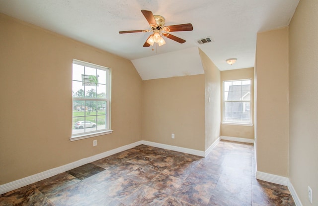 additional living space with ceiling fan and lofted ceiling