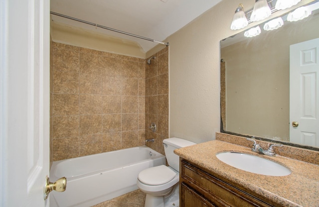 full bathroom with vanity, tiled shower / bath combo, toilet, and tile patterned floors