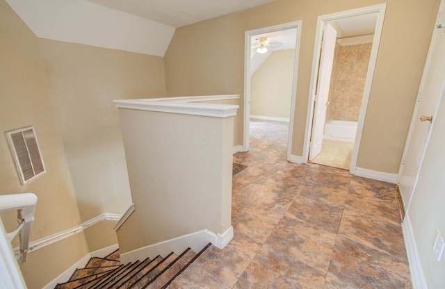 corridor featuring lofted ceiling