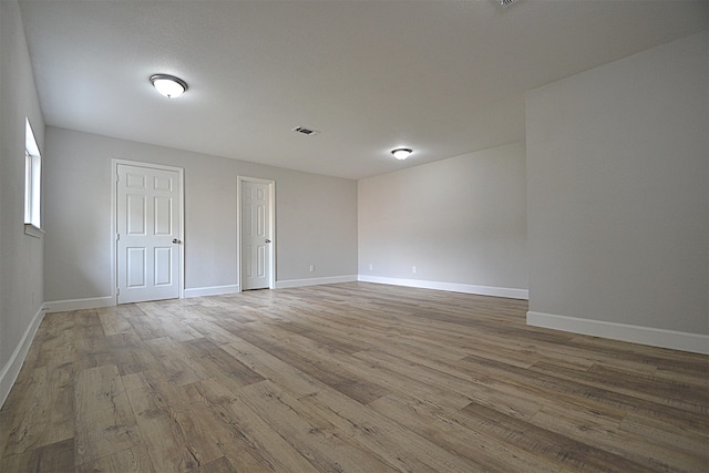 empty room featuring hardwood / wood-style flooring