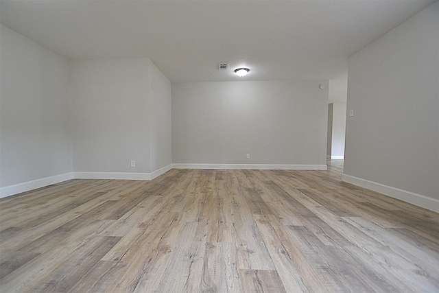 spare room with light hardwood / wood-style flooring