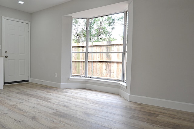 unfurnished room featuring light wood-type flooring