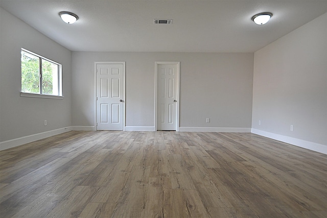 spare room featuring light hardwood / wood-style floors