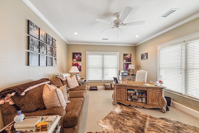 office featuring ceiling fan, ornamental molding, carpet flooring, and a healthy amount of sunlight