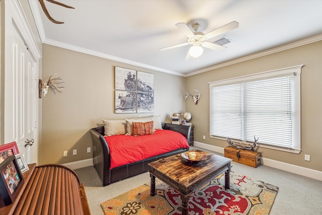 carpeted bedroom featuring ceiling fan, a closet, and crown molding