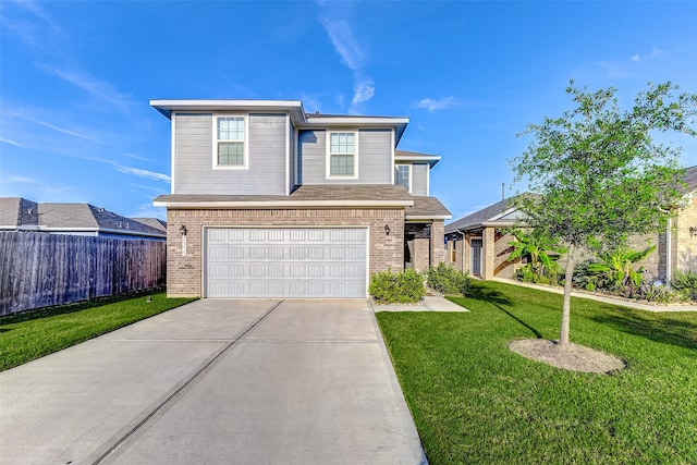 view of front of property with a garage and a front lawn