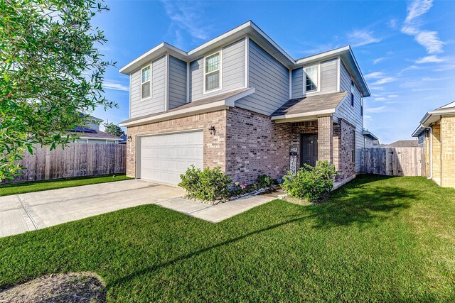 view of front of property featuring a garage and a front lawn