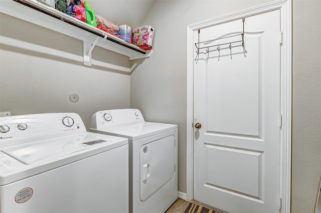 washroom featuring independent washer and dryer