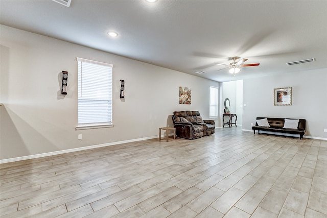 unfurnished room featuring ceiling fan and light hardwood / wood-style floors