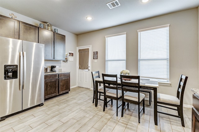 dining space with light hardwood / wood-style floors