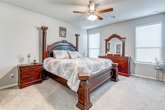 bedroom featuring ceiling fan and light carpet