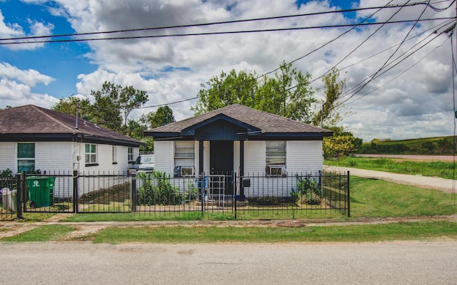 bungalow-style home with a fenced front yard