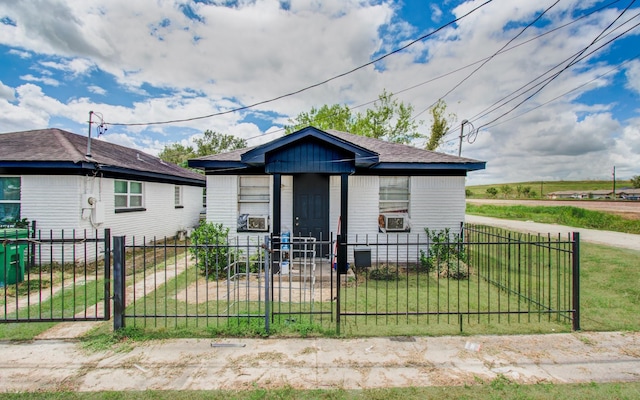bungalow-style home with a gate, a fenced front yard, cooling unit, and a front yard