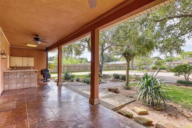 view of patio / terrace featuring ceiling fan