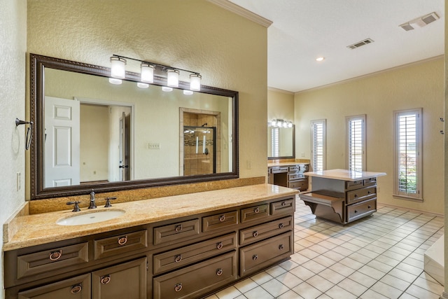 bathroom with vanity, an enclosed shower, ornamental molding, and tile patterned flooring