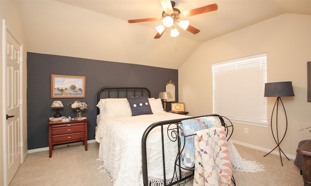 carpeted bedroom featuring lofted ceiling and ceiling fan