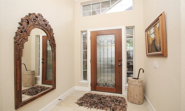 entrance foyer with light tile patterned flooring