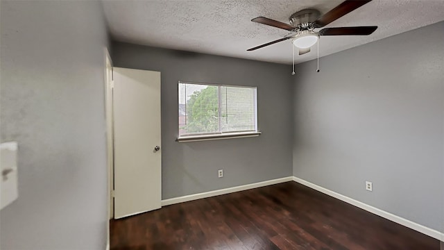 interior space with ceiling fan, a textured ceiling, and dark hardwood / wood-style flooring