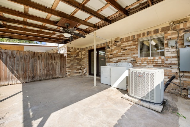 view of patio with washer and dryer, ceiling fan, and central AC