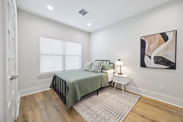 bedroom featuring hardwood / wood-style floors