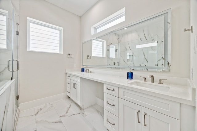 bathroom featuring vanity and a shower with shower door