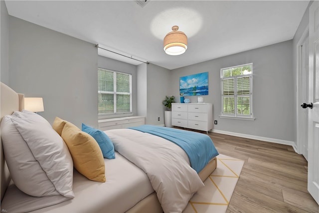 bedroom with light hardwood / wood-style flooring