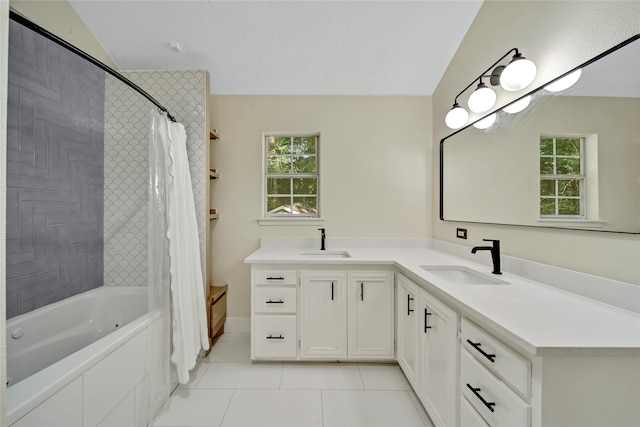 bathroom featuring shower / bath combination with curtain, lofted ceiling, tile patterned flooring, and vanity